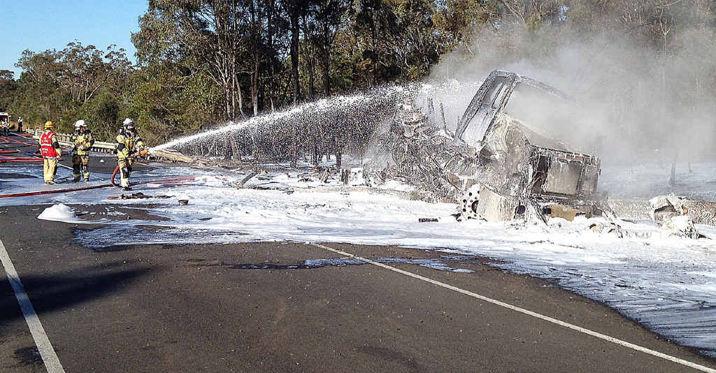 Firefighters quell a fuel tanker blaze on the Bruce Hwy. Firefighters quell a fuel tanker blaze on the Bruce Hwy.